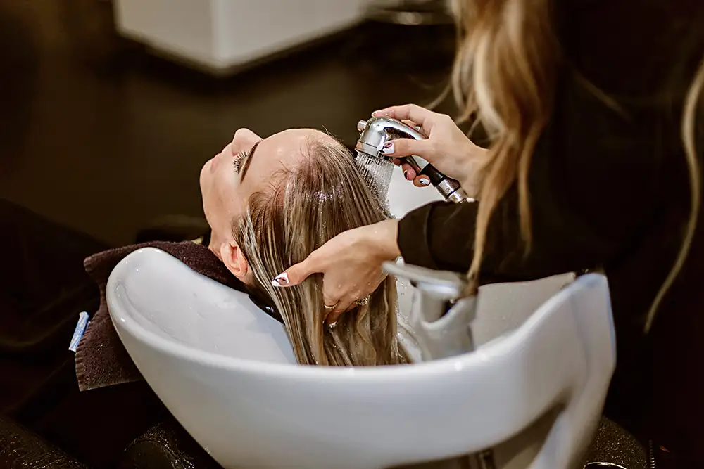 woman having hair washed